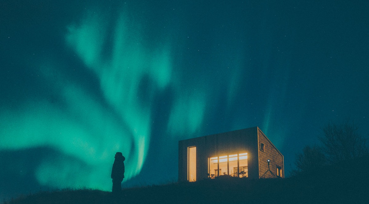 View of the Arctic Hideaway beneath the Northern Lights
