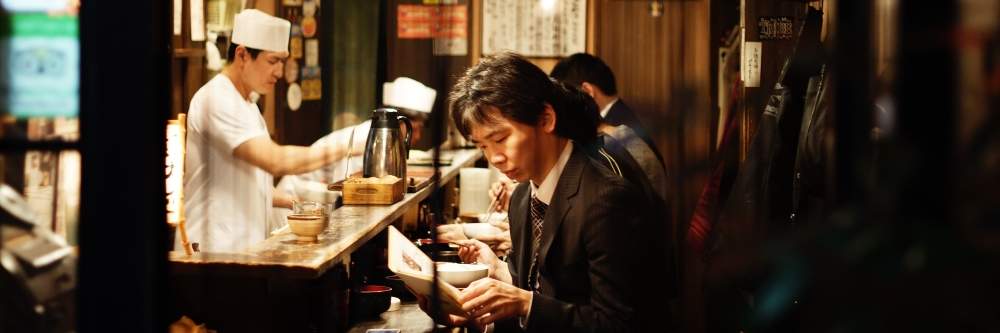 Man reading in restaurant in Tokyo