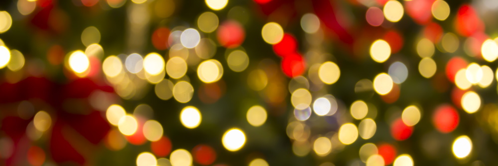 photo of gold, silver, green, and red christmas lights blurred